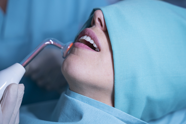 Patient receiving ozone dental treatment